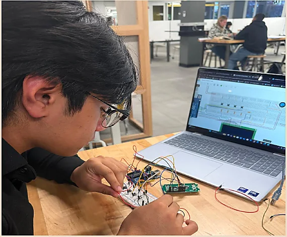 Joshua developing the Maze Runner circuit and code